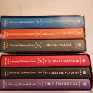 lot 1006 image: Lemony Snicket A Series of Unfortunate Events volumes 4-9 hardback books (one set unopened)