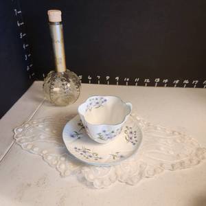 lot 1012 image: Shelley tea cup and saucer with perfume bottle