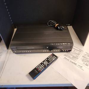 lot 1035 image: Magnavox zv457mg9 dual deck DVDVCR recorder with remote