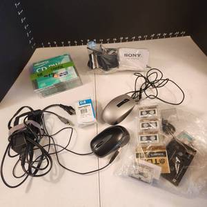 lot 1096 image: CDRW, microcassettes, computer mouse, Lenovo power cord