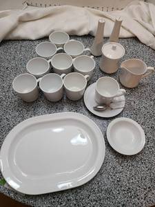 lot 1150 image: White cups, one saucer, creamer, sugar, s & p shakers, platter