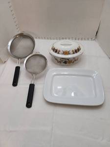 lot 1154 image: Rectangular platter 13 long, casserole dish with lid that has 2 chips on the top and 2 sieves