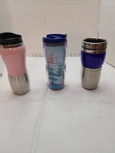 lot 1157 image: Three thermal cups, center one is Starbucks