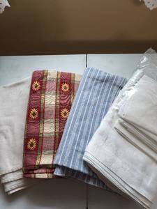lot 2045 image: 4 Table cloths, packaged white one includes fabric napkins