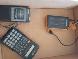 lot 3086 image: Tape recorder, calculator, and charger
