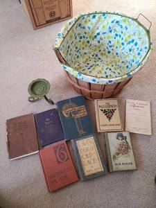 lot 3303 image: Bushel fruit basket with fabric liner, old books, candle holder