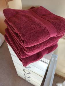 lot 3318 image: Four burgandy bath towels