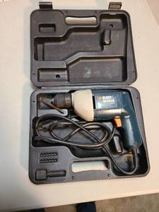 lot 4016 image: Black and Decker electric drill in plastic case