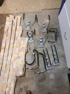 lot 4032 image: Rubbermaid garage organization system with 2 black rails, 2 rail backs 56 each and 10 hook organizers (3 bike hooks)
