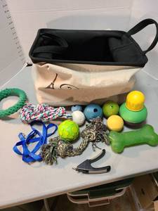 lot 4109 image: Large dog toy bag with dog toys and nail clippers