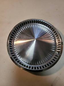 lot 4128 image: Plymouth hub cap, 1957