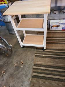 lot 4305 image: Wooden cart on rollers 33x24x18 shelves are unfinished wood