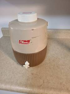 lot 4421 image: Vintage Coleman water jug tan metal top with brown plastic bottom