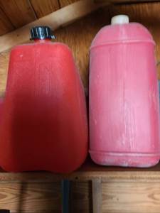 lot 5107 image: Two 5 gallon gas cans