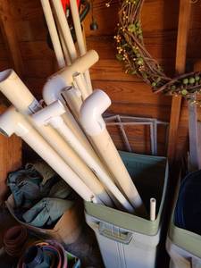 lot 5120 image: Trash can with PVC pipe