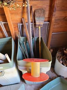 lot 5121 image: Trash can with reel, piece of rebar, bamboo stakes