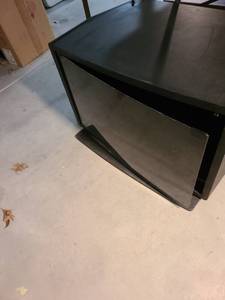 lot 6004 image: TV stand black with glass door, 20x30x19, small paint spatters on right side