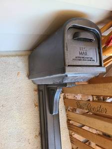 lot 6008 image: Black plastic mailbox 55 tall, appx. 10x10x21