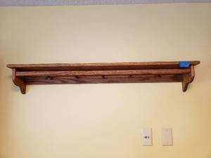 lot 3100 image: Oak display shelf with pegs and bar 48 x 7