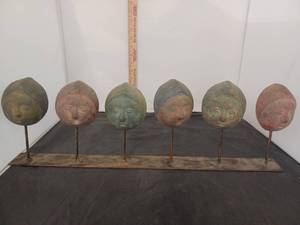 lot 295 image: Faces on Stand, one face has been repaired