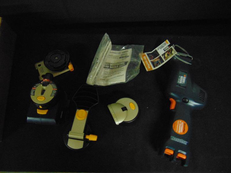 lot 9033 image: Mixed lot tools, (1) Black & Decker Reciprocating Saw, battery not included, (1) Ryobi Laser level w change-able heads- air grip pad is damaged