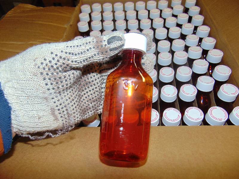 lot 9055 image: (1) case PE-4A, 4 oz. Amber Plastic Oval medicine Bottles, approx 90 bottles per case