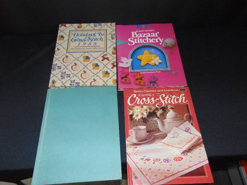 lot 9141 image: (4) ct. lot Hardback books- cross-stitching
