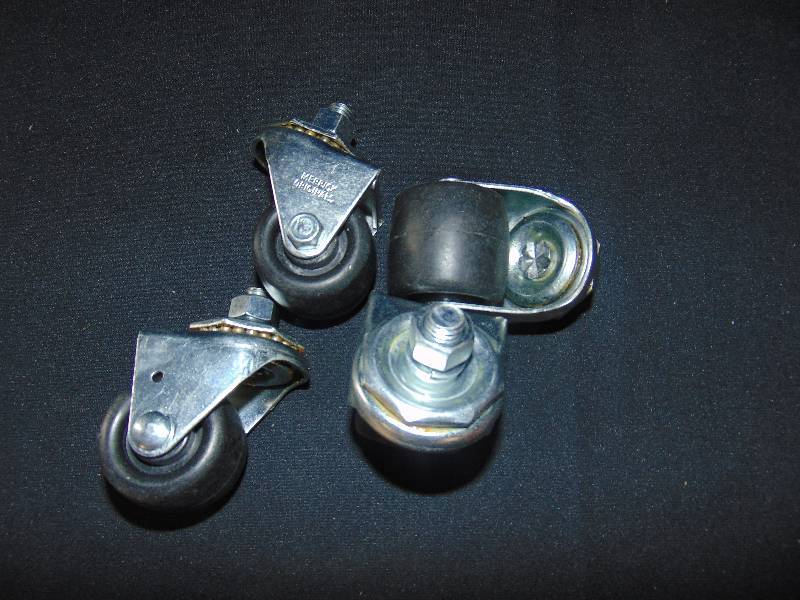 lot 9253 image: (4) ct. lot black caster wheels, screw-in mount wheels, 2 diameter w 12 diameter bolt, nut and locking washer