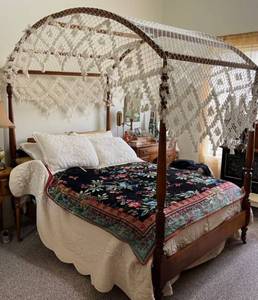 lot 1001 image: Vintage wood full size canopy bed (does not include bedding on mattress in set up photos) with Stearns and Foster mattress (appears barely used)