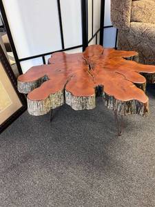 lot 1012 image: Crosscut natural edge tree table 19 x 37 x 35 in approximately