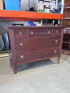 lot 1015 image: Vintage rolling wood 5 drawer dresser 35 x 44 x 22 in