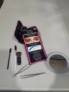 lot 1093 image: Makeup mirror, brushes and brow stencils