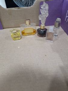lot 1098 image: Small perfume bottles. Versace Gold, Avon and more. One is empty