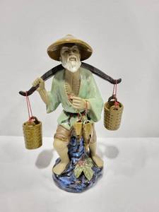 lot 1102 image: Glazed ceramic fisherman statue 13.5x9.5