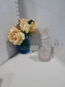 lot 1156 image: Empty perfume bottles and a glass vase with faux flowers
