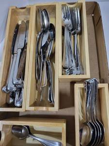 lot 1222 image: Silverware knives 12, dinner forks 9, salad forks 10, teaspoons 7 tablespoons 8, serving spoons 3