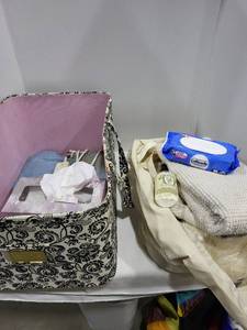 lot 1232 image: Sheffield tote bag, laundry bag with toilet paper 2 towels , heating pad, Kleenex, Pool Pourri, Cottenelle flushable wipes