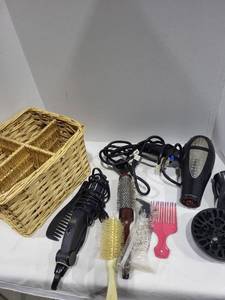 lot 1236 image: Wicker basket, Infiniti blow dryer with attachments , Vidal Sassoon flat iron,brushes, combs
