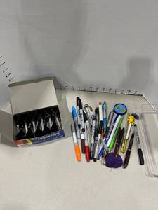 lot 1521 image: Binder clips Sharpie markers and pens