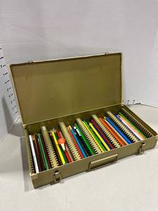 lot 1533 image: Metal colored pencil case with pencils