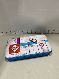 lot 1534 image: Pastels colors with Monopoly tin