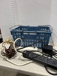 lot 1569 image: Shopping crate basket with extension cords and power strips