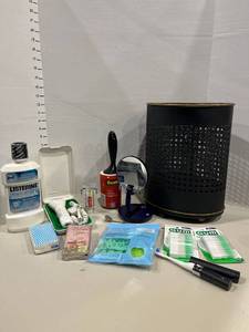 lot 1275 image: Metal waste basket with assorted toiletries