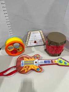 lot 1742 image: Leap Frog touch magic guitar with toy musical instruments