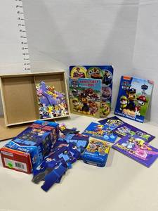 lot 1751 image: Paw Patrol and Mighty Heroes puzzles and activity books