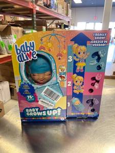 lot 68007 image: Baby Alive Baby Grows Up (Happy) - Happy Hope or Merry Meadow, Growing and Talking Baby Doll, Toy with 1 Surprise Doll and 8 Accessories , Blue