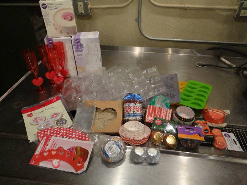 lot 180 image: Lot of Cupcake Liners, Decorations, Flutes, Pastry Liners, Wilton Fondant, CandySucker Molds. Pampered Chef Cookie Press & Icing Mix.