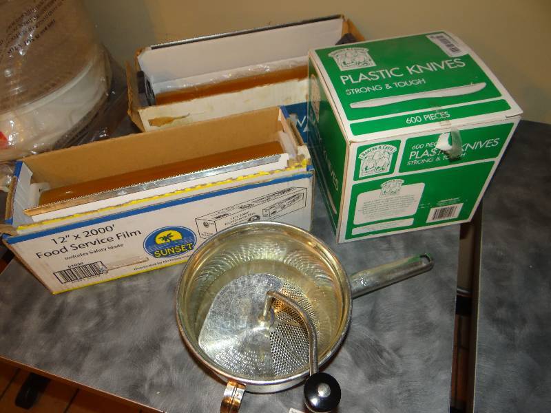 lot 186 image: 2 Rolls of Food Service Film, Box of Plastic Knives & a Stainless Steel Food Mill.