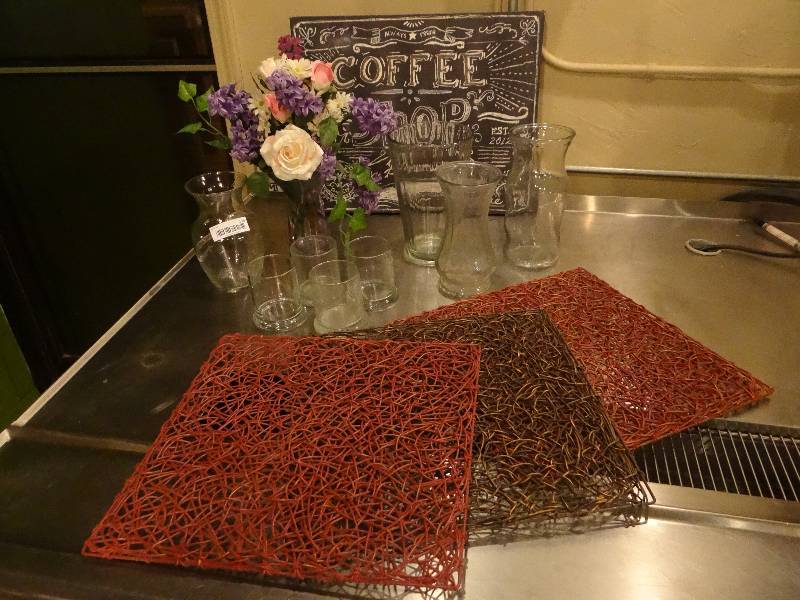 lot 235 image: 5 Glass Vases, Floral Arrangement, Set of 4 Glasses, 3 pcs. of Rattan Wall Art, & Coffee Shop Box Print.