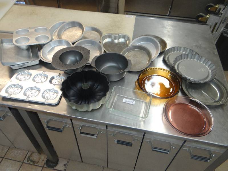 lot 201 image: Large Lot of Metal & Glass Pie & Cake Pans, Loaf Pans, & Cookie Mold.